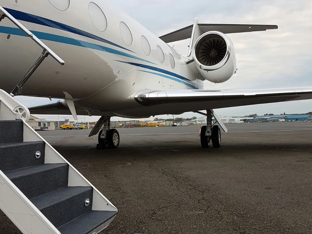prestwick-aviation-services-executive-jet-with-stairs-down-awaiting-passenger-arrival